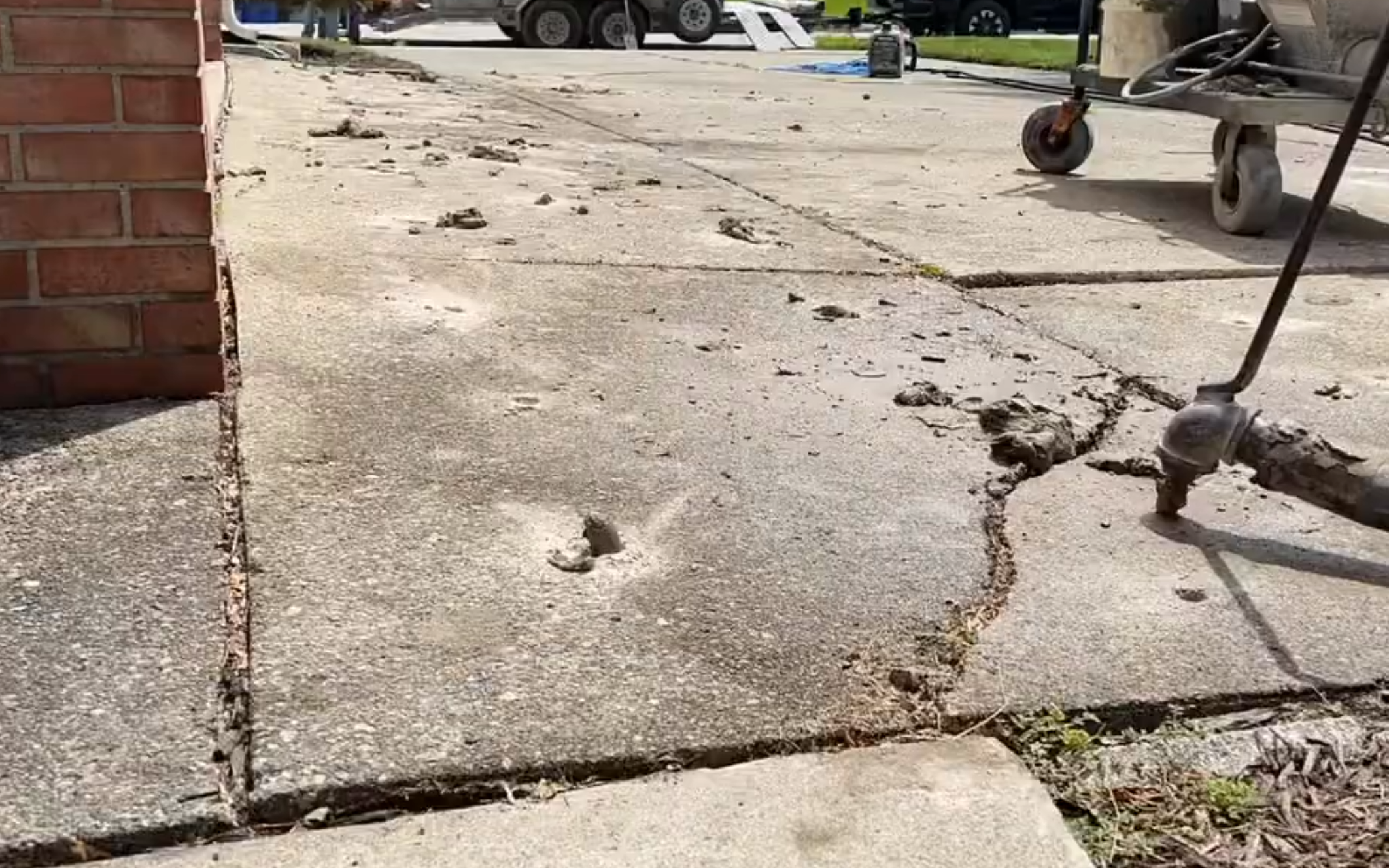 Mudjacking sunken concrete slab